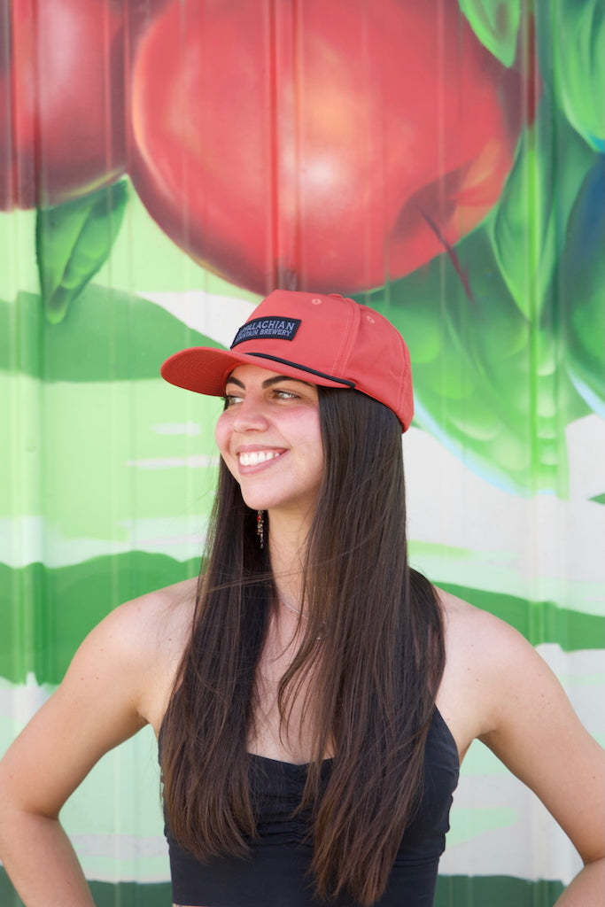 Person wearing Appalachian Mountain 5-panel red snapback hat