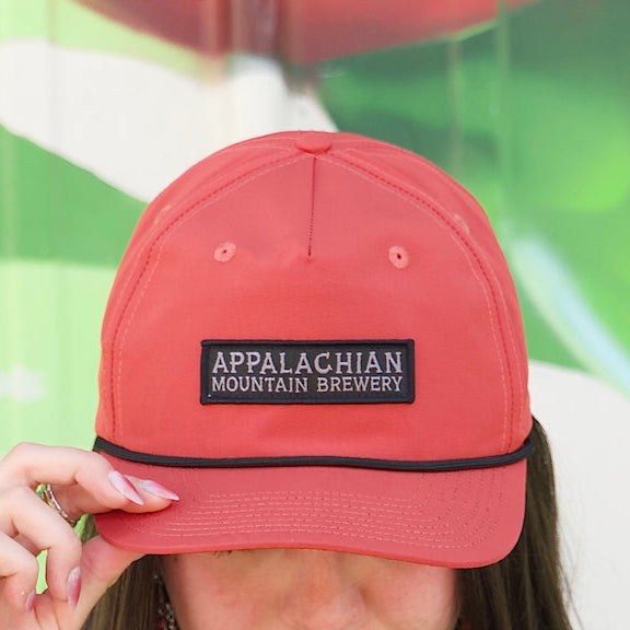 Person wearing Appalachian Mountain 5-panel red snapback hat