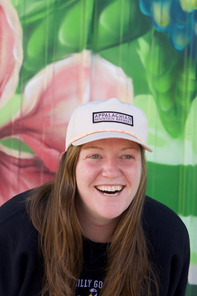 Person wearing Appalachian Mountain 5-panel cream snapback hat
