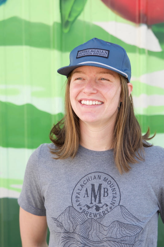 Person wearing Appalachian Mountain 5-panel blue snapback hat
